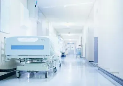 A hospital corridor with empty gurney